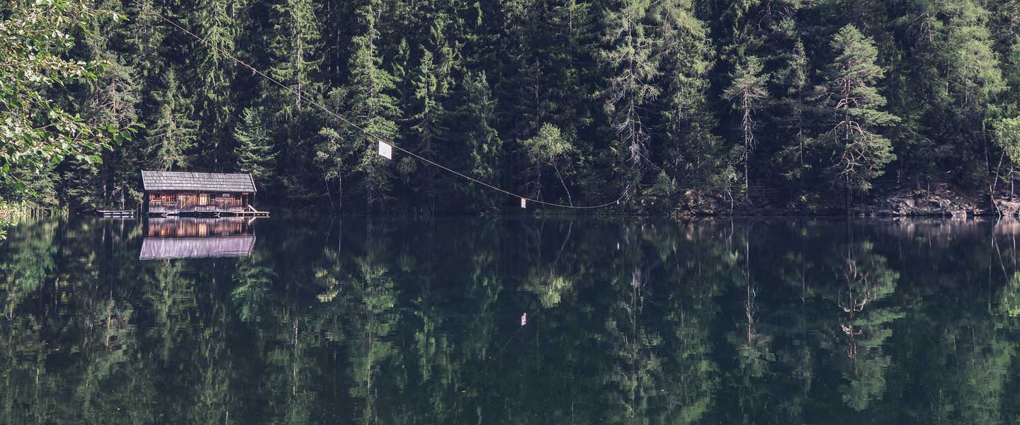cabin on a lake with reflection