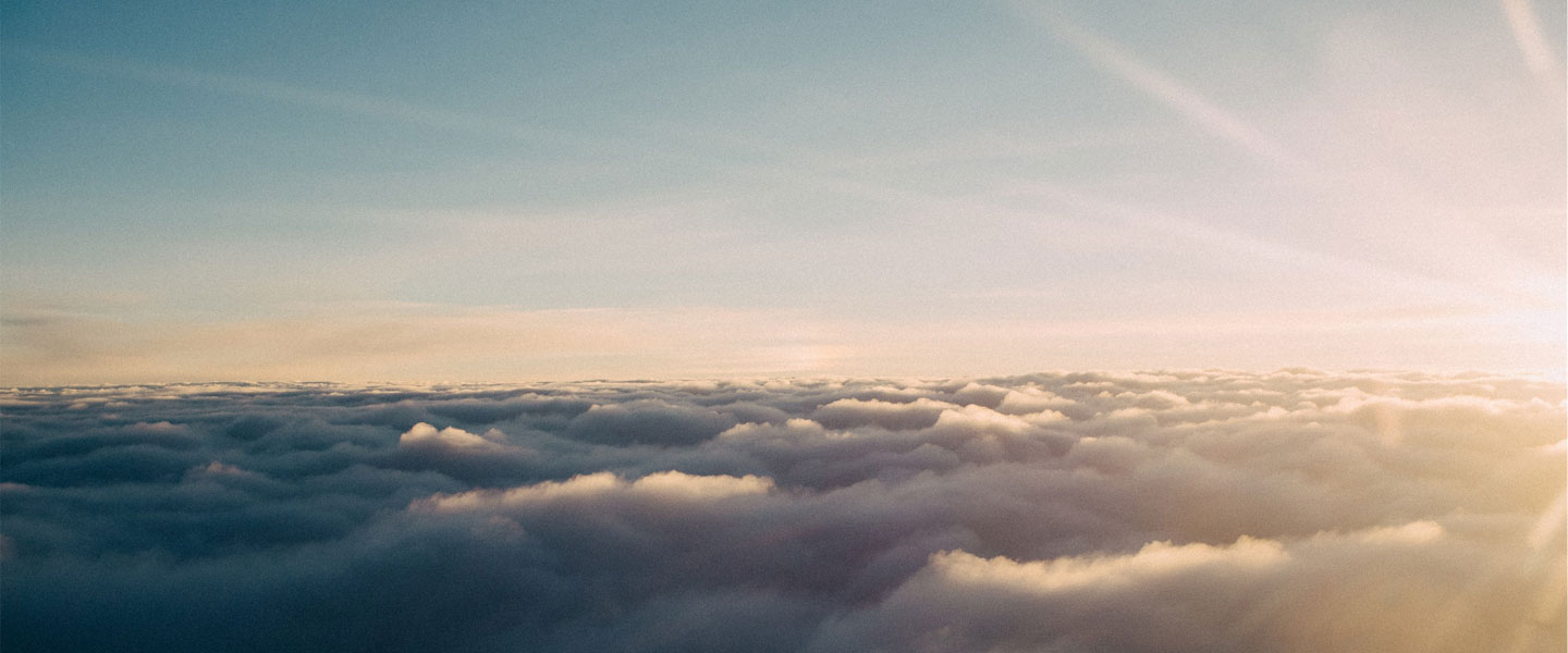 image of clouds from above with sunshine